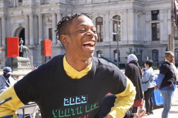 Activist in front of City Hall during rally against gun violence