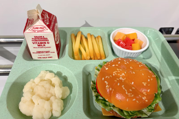 A school lunch tray with fake food, created as part of a school lunch exhibit