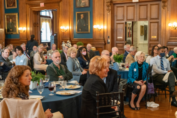 People at a luncheon looking towards a speaker