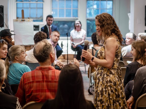 Event moderator asking an audience member a question