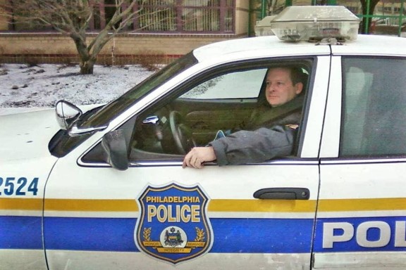 Officer Pat Heron in the driver's seat of his patrol car