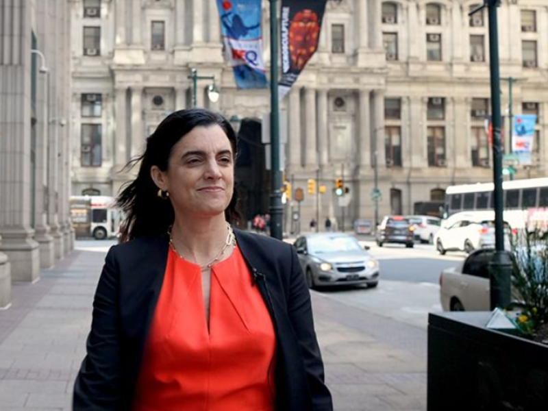 Rebecca Rhynhart walking down a street near Philadelphia City Hall