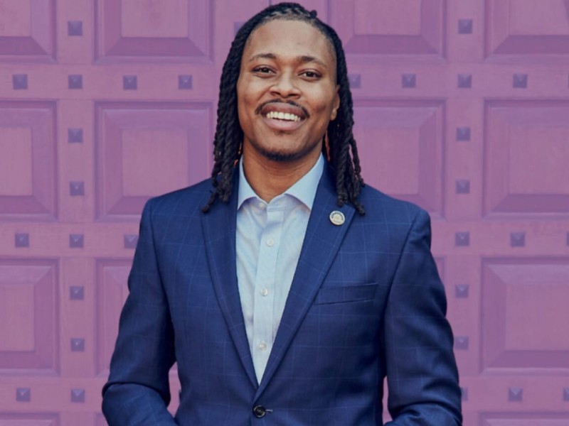 Rep Malcom Kenyatta in front of purple background