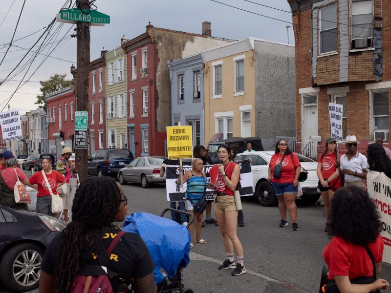 Demonstrators with signs demanding justice for Eddie Irizarry at Willard and Lee intersection