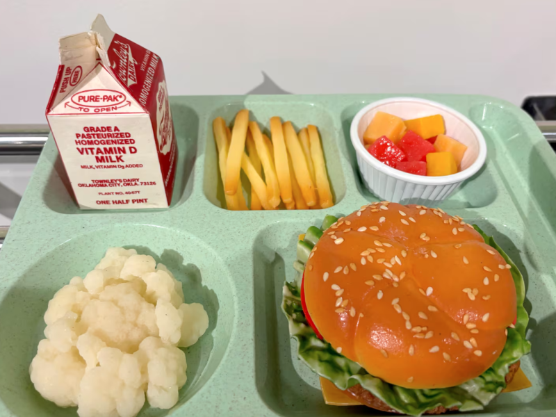 A school lunch tray with fake food, created as part of a school lunch exhibit