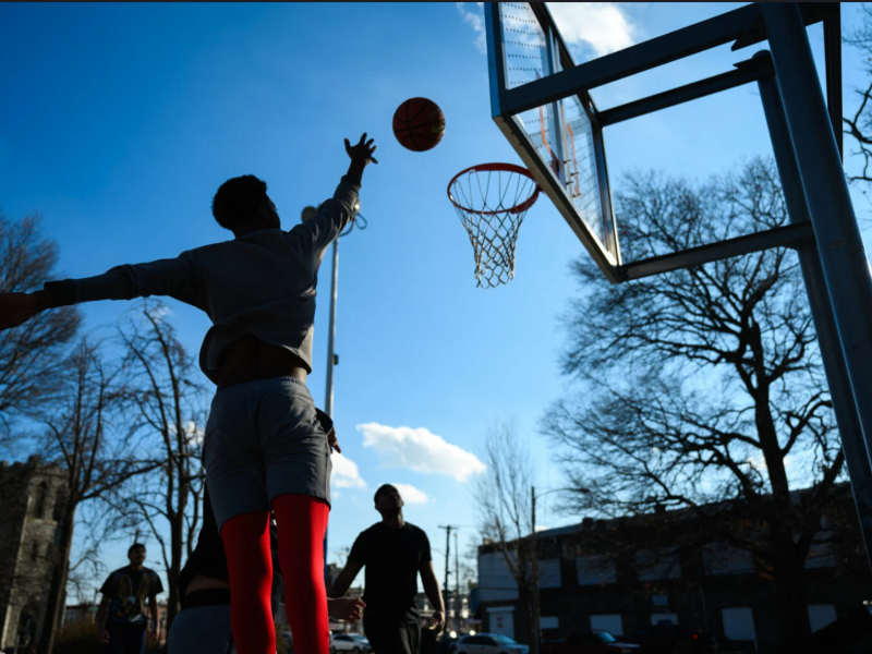 A young person playing basketball in Philadelphia