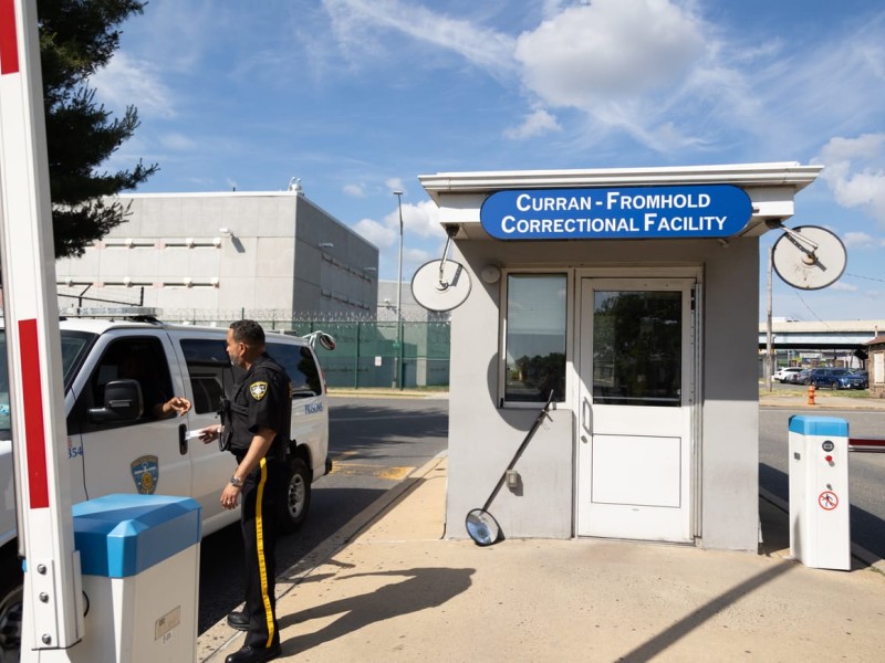 A van exits the parking lot of Curran-Fromhold Correctional Facility on State Road in Northeast Philadelphia.