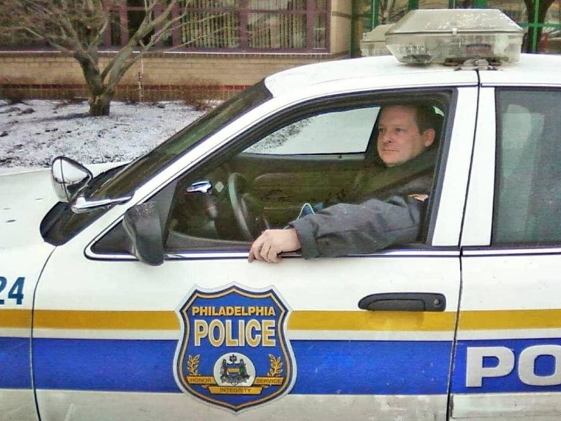 Officer Pat Heron in the driver's seat of his patrol car