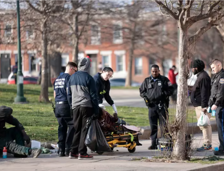 First responders adminstering Narcan to a potential overdose victim