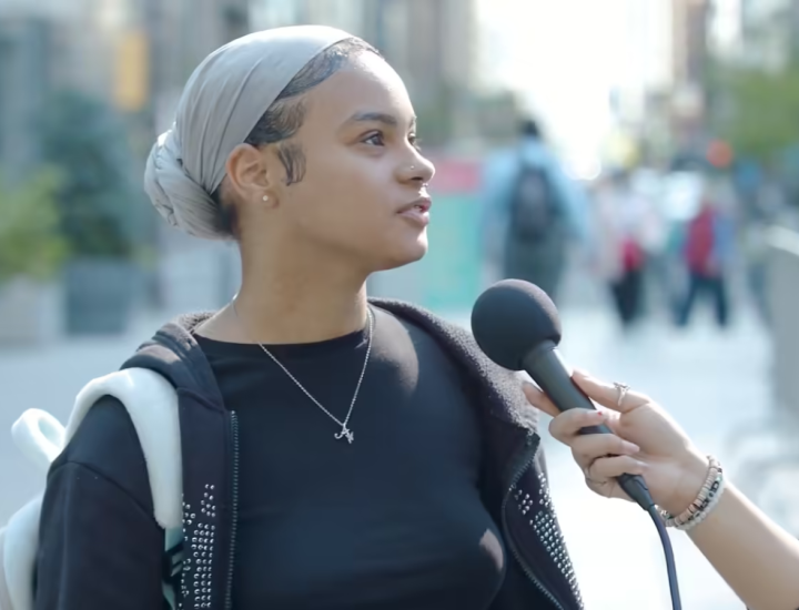 A woman being interviewed on the street