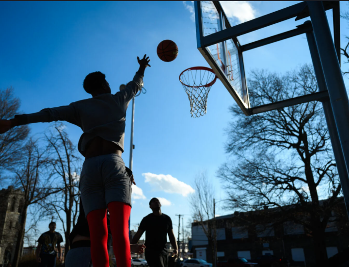 A young person playing basketball in Philadelphia