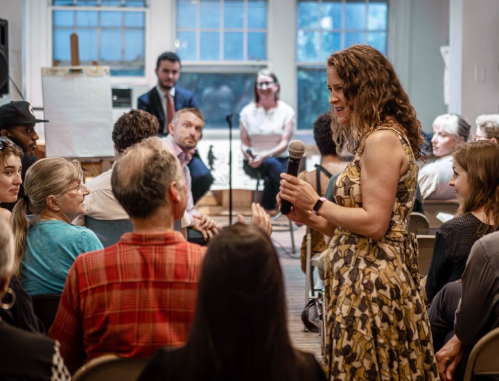 Event moderator asking an audience member a question